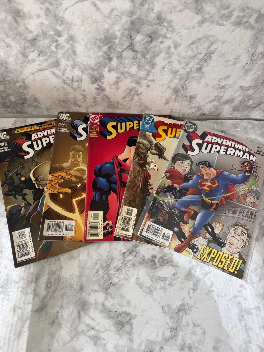 DC Adventures Superman Comic Set with Red, Blue, Gold, Brown Covers